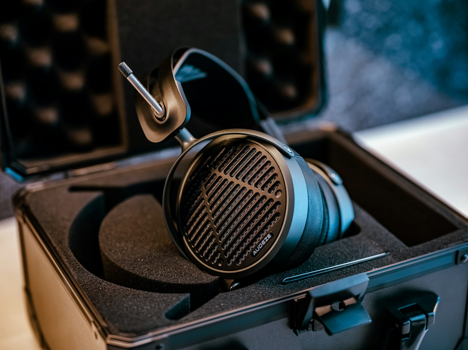 grayscale photo of condenser microphone beside pop filter